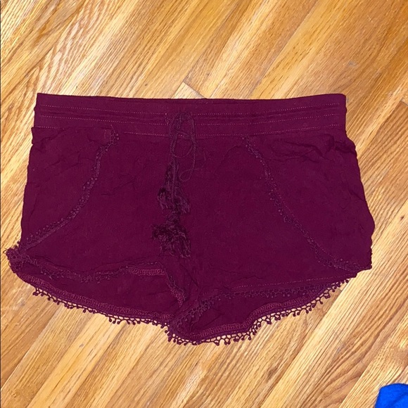 Pants - Maroon shorts.